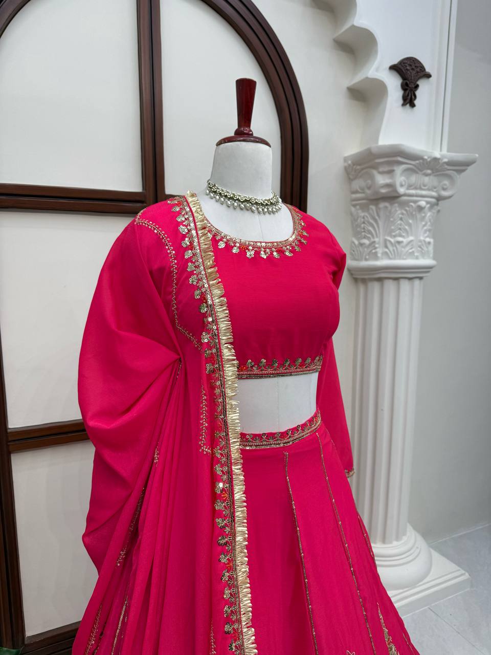 Radiant Rani Pink Silk Lehenga Choli Adorned with Opulent Heritage Floral Motifs and Intricate Zari Borders